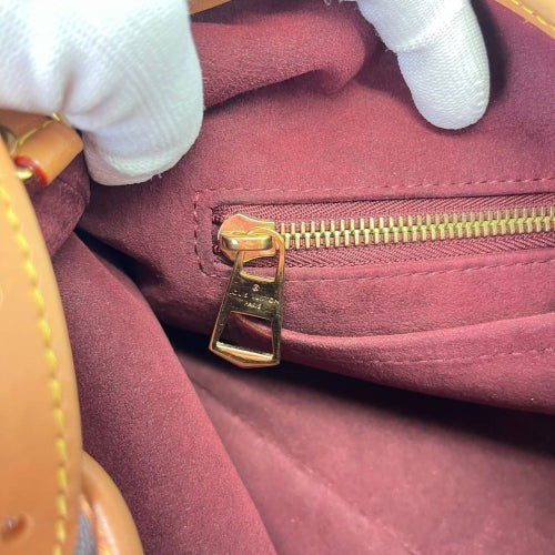 CURATED by Kira Louis Vuitton Carryall PM interior showing burgundy lining, gold zipper pull, and leather trim