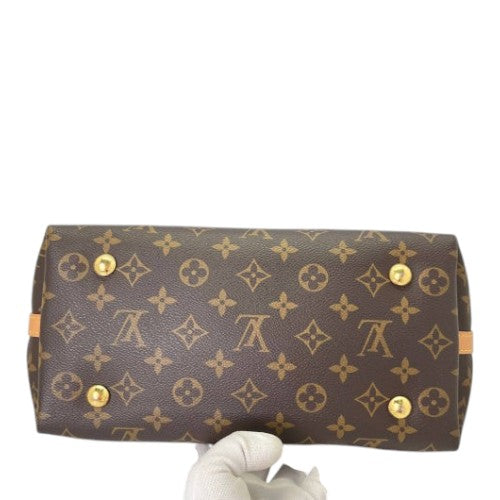 CURATED by Kira Louis Vuitton Carryall PM bag base showing brown monogram canvas and gold protective feet