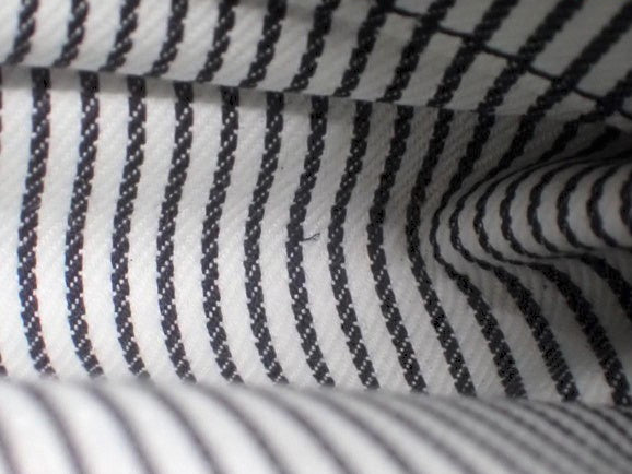 CURATED by Kira Louis Vuitton Nigo Monogram Denim interior lining featuring black and white striped fabric