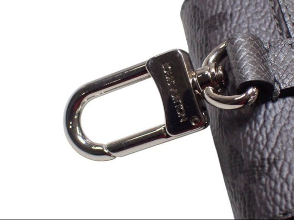 CURATED by Kira Louis Vuitton Taigarama earphone pouch in grey Taiga leather with silver-tone metal lobster clasp