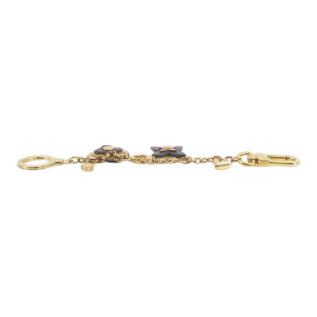 CURATED by Kira Louis Vuitton M63086 gold charm featuring iconic monogram flower motifs and a lobster clasp