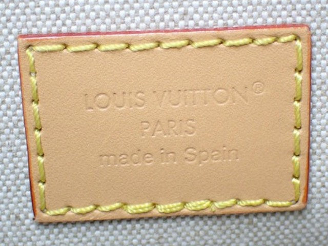 CURATED by Kira Louis Vuitton Nile NM heritage leather interior tag with embossed logo and yellow contrast stitching