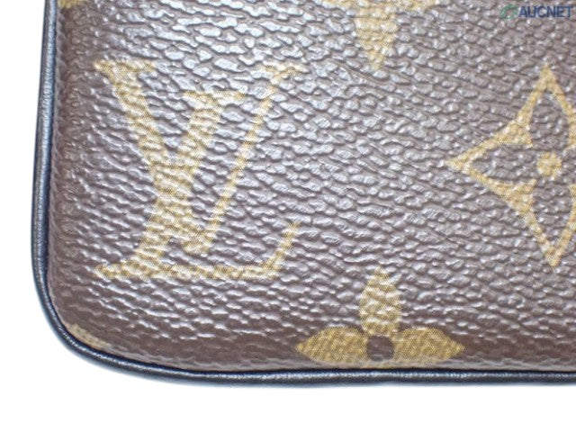 CURATED by Kira Louis Vuitton Zipped Pouch MM in iconic brown monogram coated canvas with textured finish