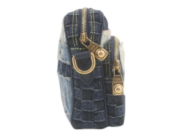 CURATED by Kira Louis Vuitton Nigo Monogram denim crossbody bag in blue with gold hardware, side view.