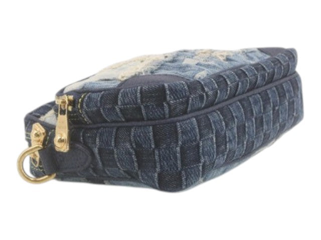 CURATED by Kira Louis Vuitton Nigo Monogram denim pouch in blue with a woven patchwork design and gold hardware