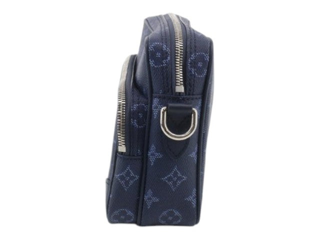 CURATED by Kira Louis Vuitton Nile NM monogram heritage ocean blue crossbody bag, side view with silver hardware.