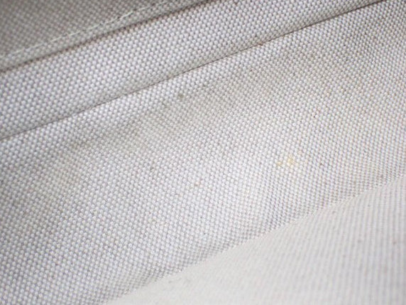 Interior lining of a CURATED by Kira Louis Vuitton Nile NM bag in light beige canvas fabric