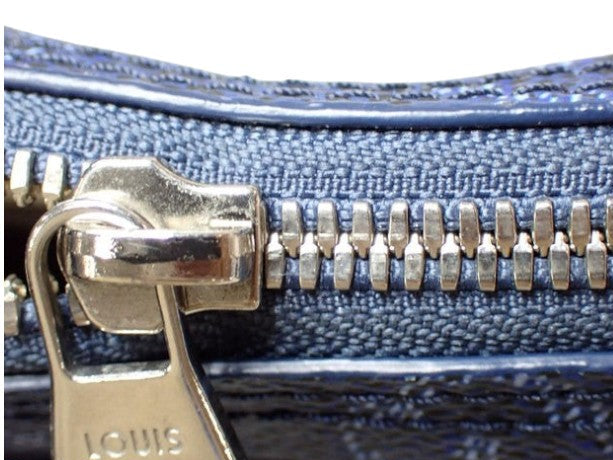 CURATED by Kira Louis Vuitton Nile NM Monogram Heritage ocean blue bag zipper detail with silver hardware