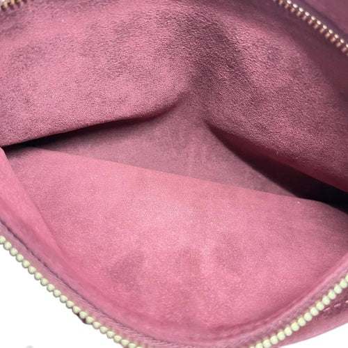 Interior view of a CURATED by Kira Louis Vuitton Carryall PM pouch featuring a soft mauve fabric lining
