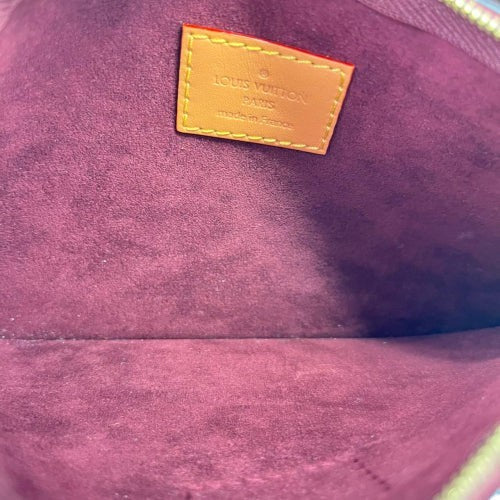 CURATED by Kira Louis Vuitton Carryall PM pouch interior featuring a burgundy suede lining and leather logo patch.