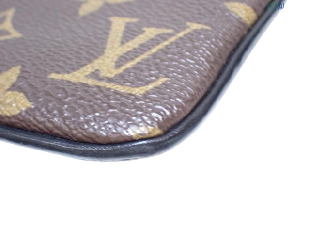 CURATED by Kira Louis Vuitton Zipped Pouch MM in brown monogram coated canvas with black leather trim detail