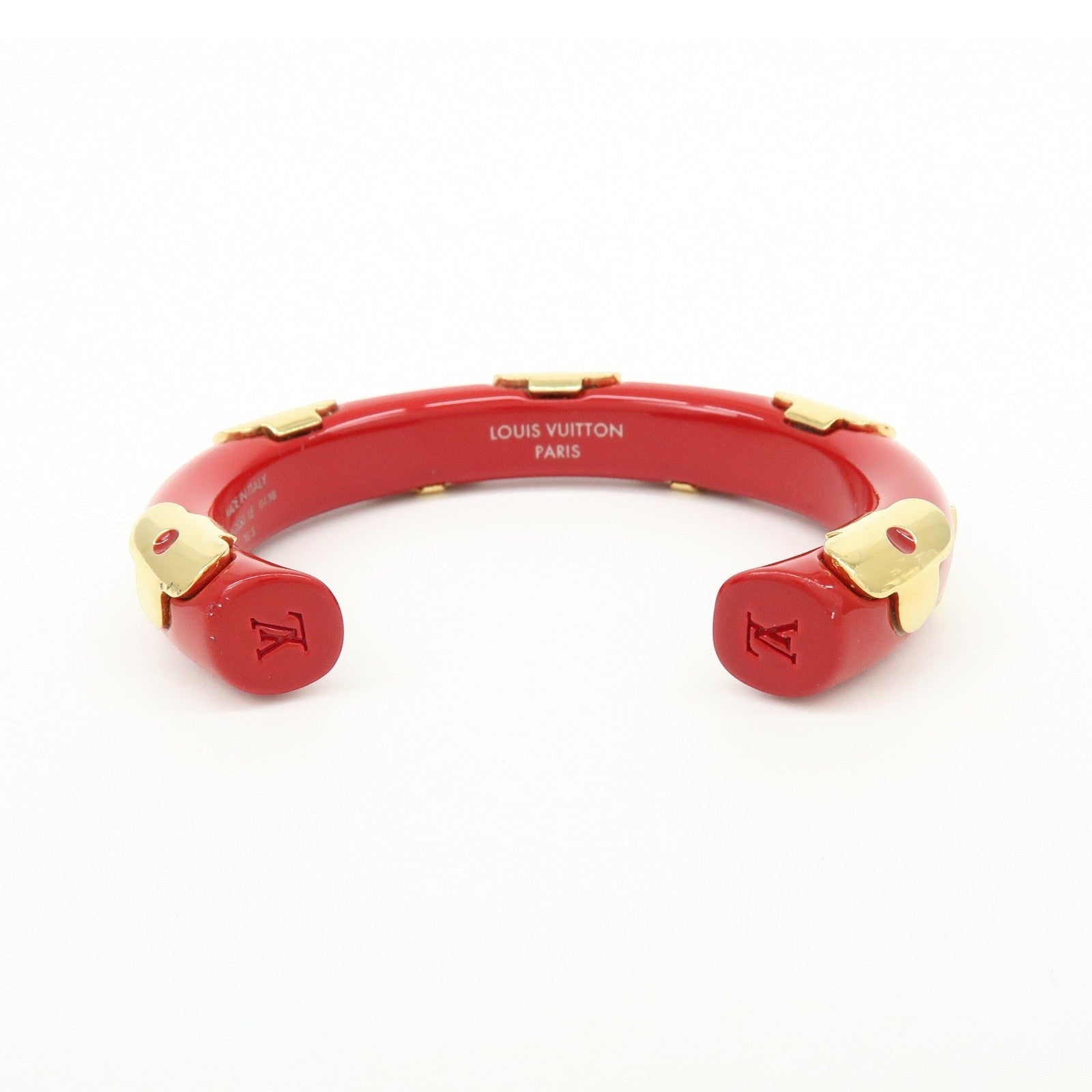 CURATED by Kira Louis Vuitton Paris red resin and gold-tone metal bangle bracelet with engraved LV logo.