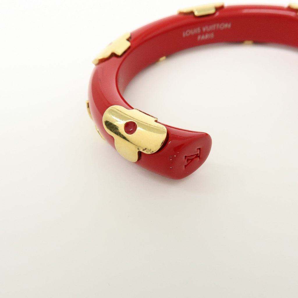 CURATED by Kira Louis Vuitton Paris red resin and gold-tone metal flower accent bangle bracelet