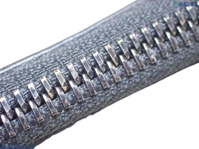 Close-up of the silver metal zipper teeth on a brown Louis Vuitton Zipped Pouch MM from CURATED by Kira