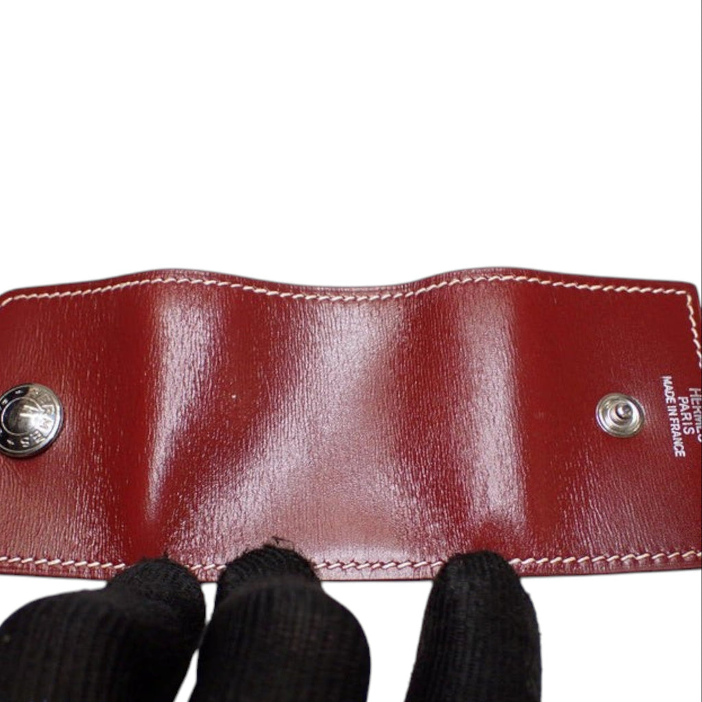 CURATED by Kira maroon Hermes notepad with white contrast stitching and silver-tone snap button closures
