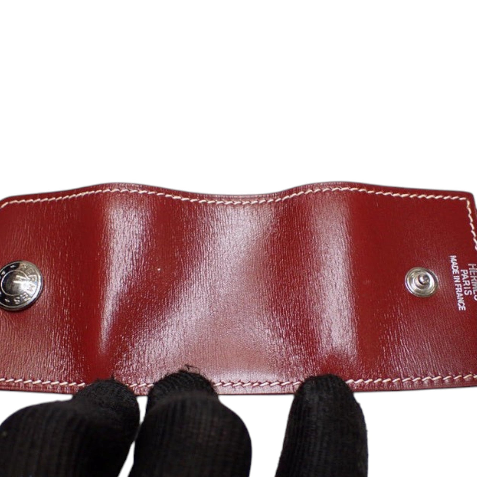 CURATED by Kira maroon Hermes notepad with white contrast stitching and silver-tone snap button closures