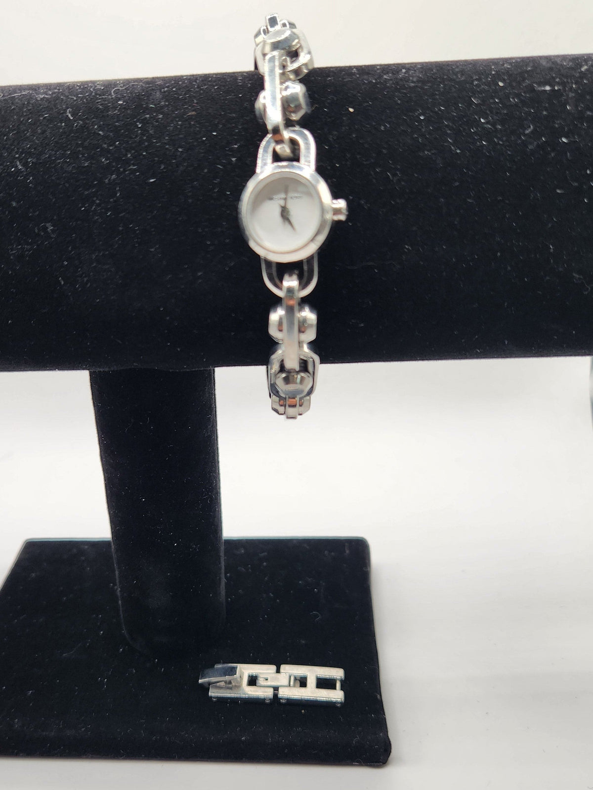 CURATED by Kira Michael Kors Astor silver stainless steel bracelet watch with a round white dial and chain-link band