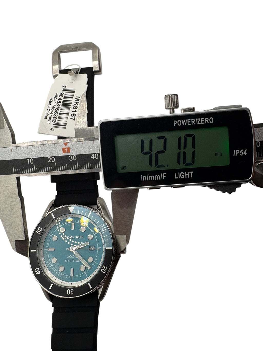 CURATED by Kira Michael Kors Maritime men's watch with a pale blue dial and black silicone strap being measured.