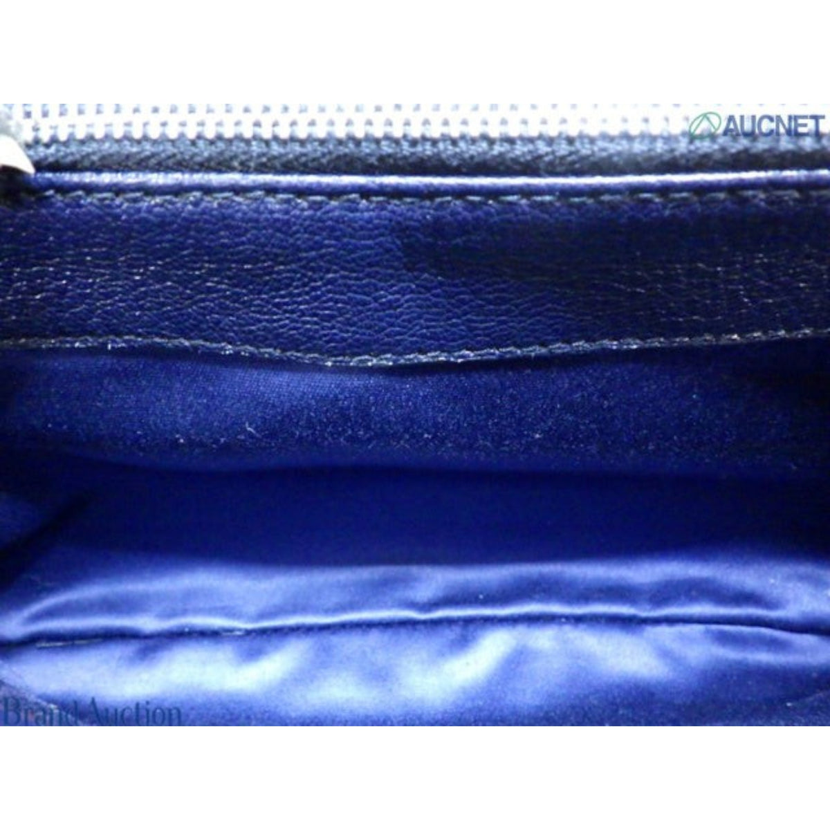 Interior view of CURATED by Kira Miu Miu navy blue denim Matelassé bag with smooth fabric lining