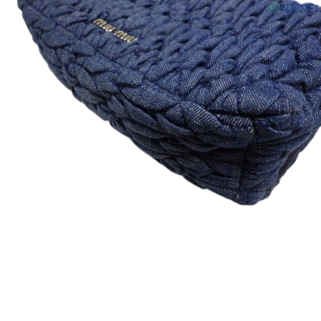 CURATED by Kira Miu Miu navy denim matelassé bag with silver metallic logo detail