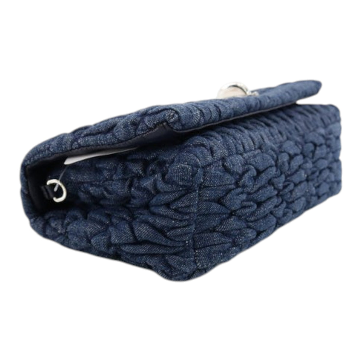 CURATED by Kira Miu Miu denim matelassé shoulder bag in navy with silver turn lock hardware, side profile view.