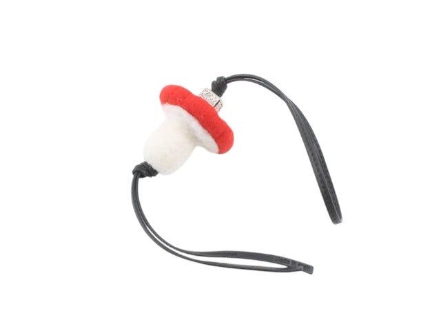 CURATED by Kira red and white mushroom bag charm keychain with black strap and silver accent