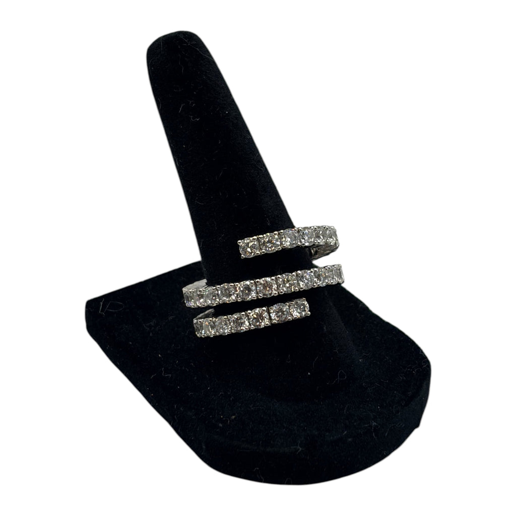 CURATED by Kira Nadri silver tone double row CZ eternity band ring on a black velvet display stand