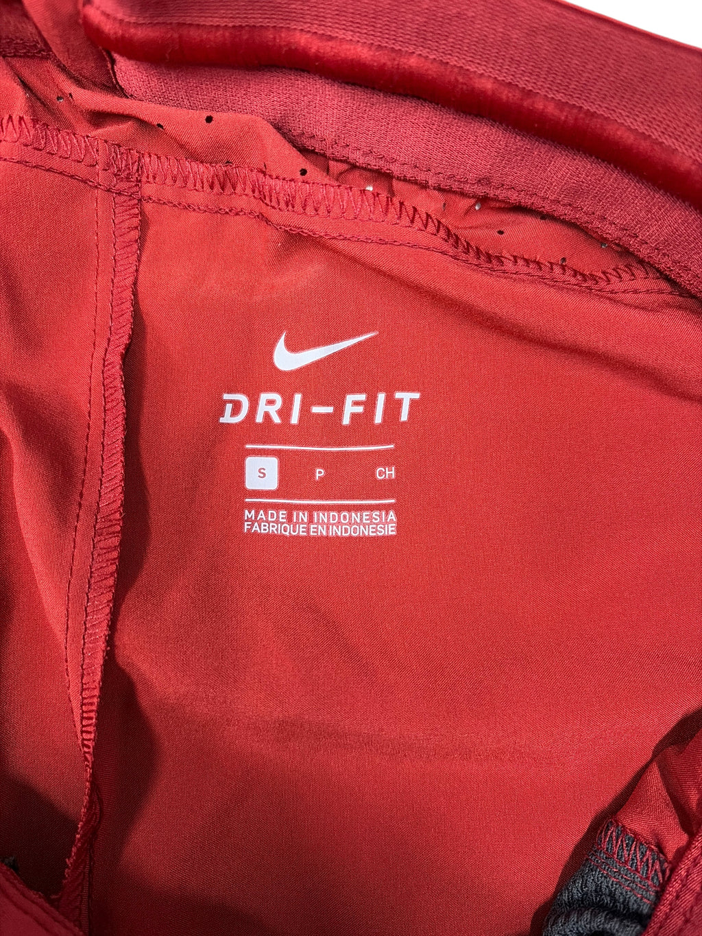 CURATED by Kira Nike Dri-FIT cardinal red athletic track pants interior label with size small tag