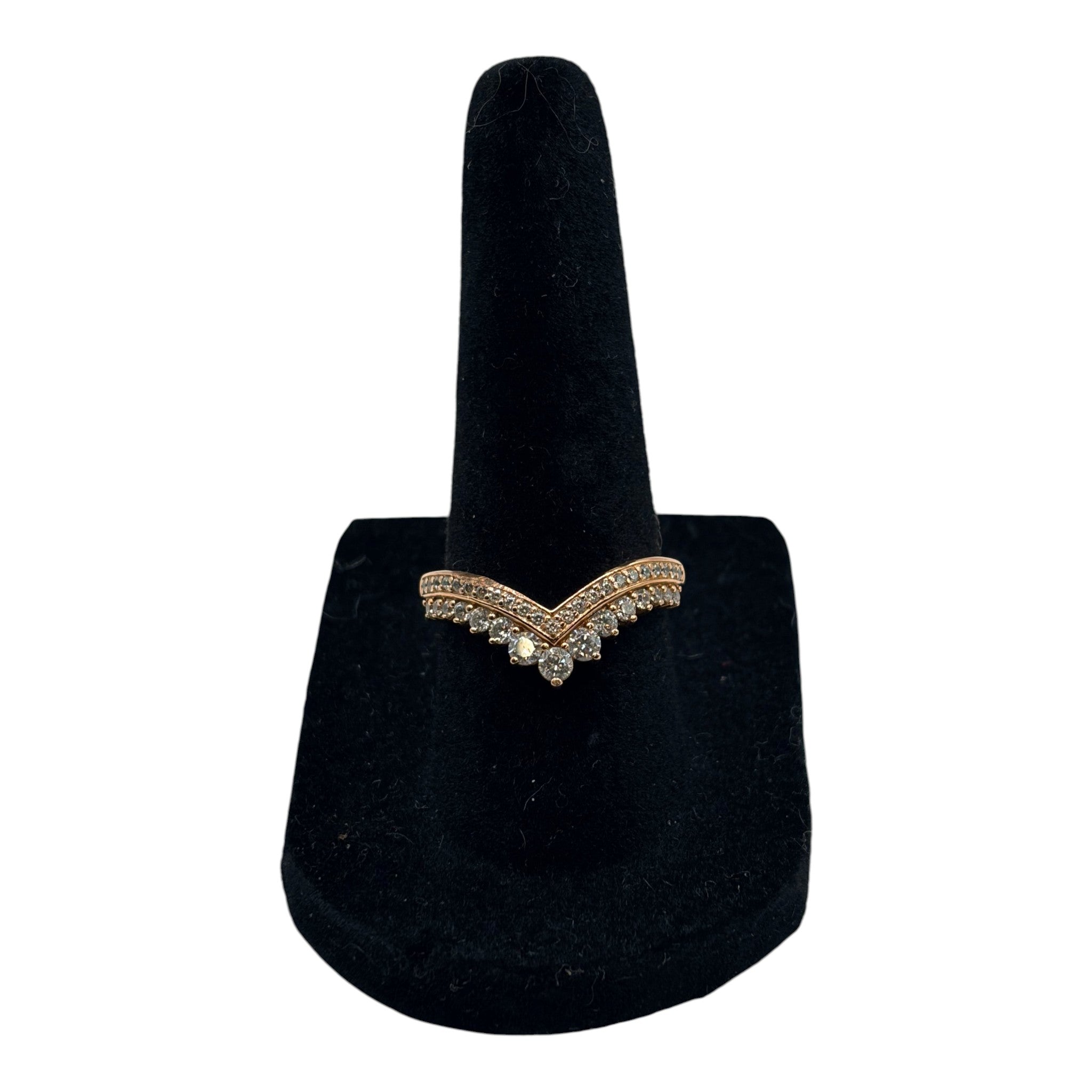 CURATED by Kira Pandora Princess Wishbone ring in 14k rose gold plating with sparkling pavé stones on a black stand