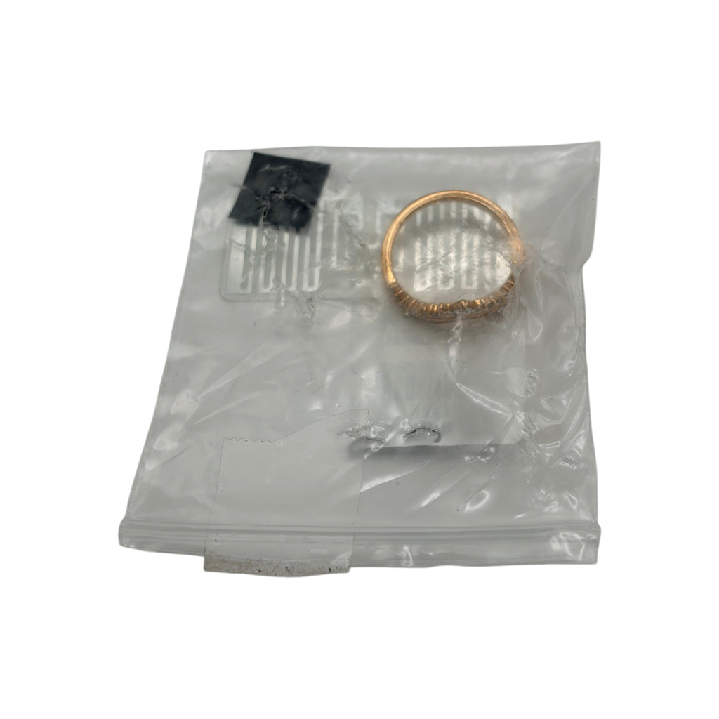 CURATED by Kira Pandora Princess Wishbone ring in 14k rose gold plating inside a clear plastic storage bag