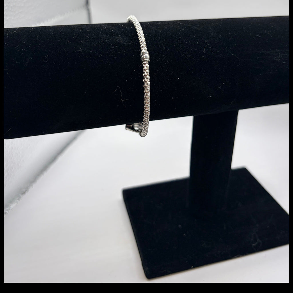 CURATED by Kira Pandora sterling silver beads and pave bracelet on a black velvet display stand