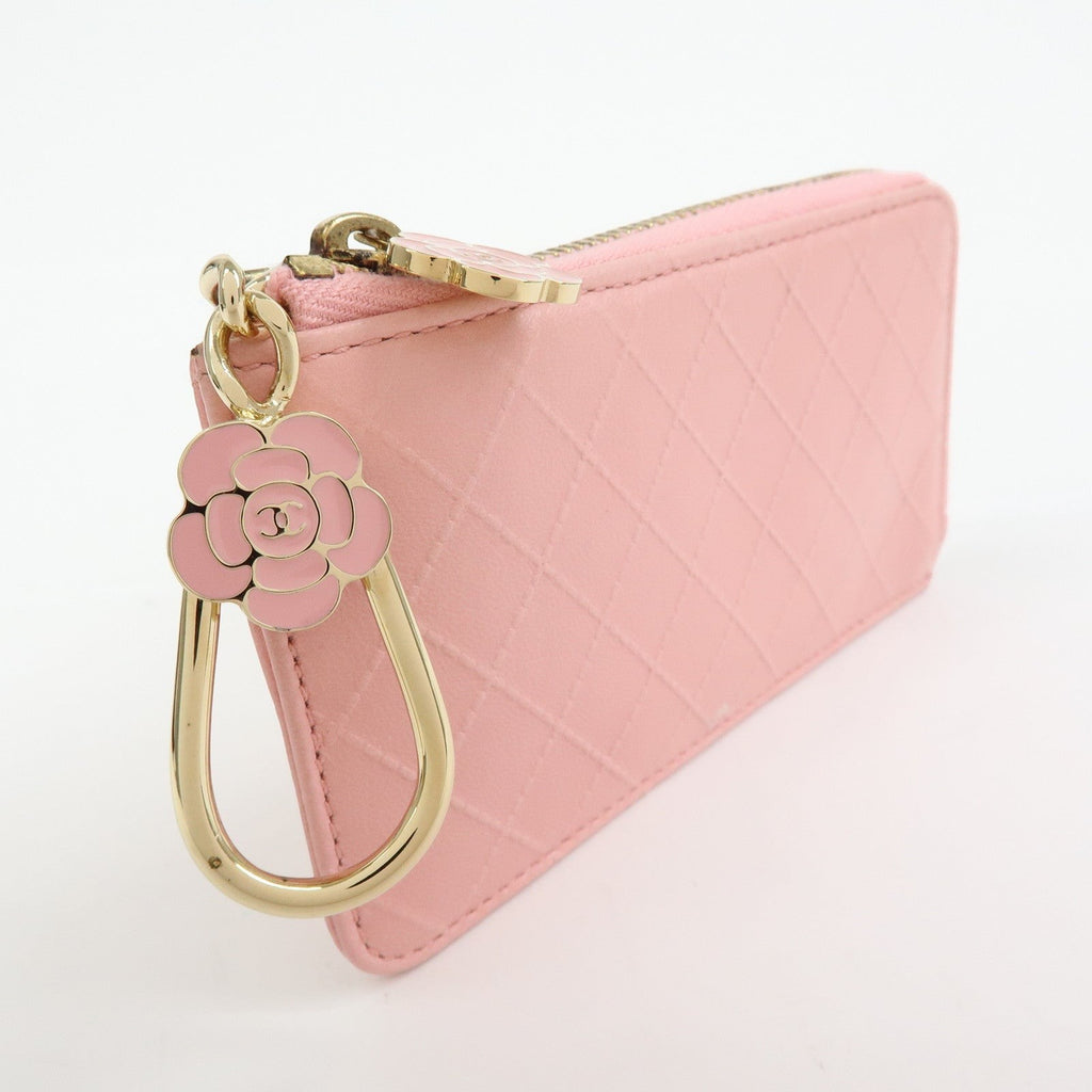 CURATED by Kira pink quilted leather zip-around card holder with gold hardware and pink camellia charm.