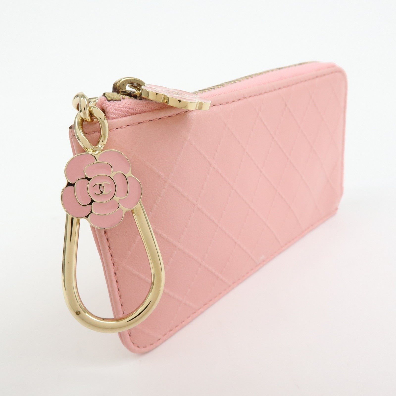 CURATED by Kira pink quilted leather zip-around card holder with gold hardware and pink camellia charm.