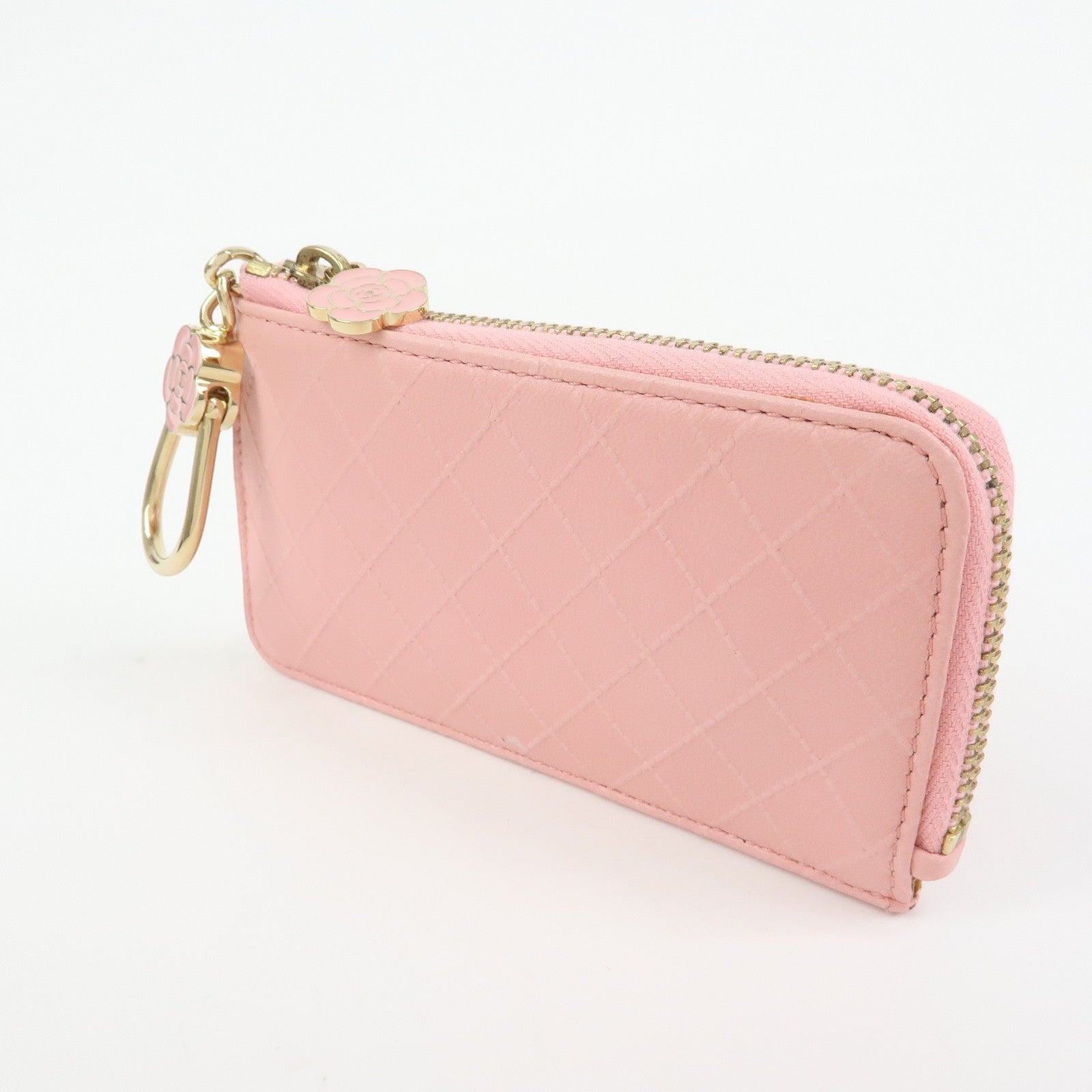 CURATED by Kira pink quilted leather zip-around card holder with camellia charm and gold hardware.