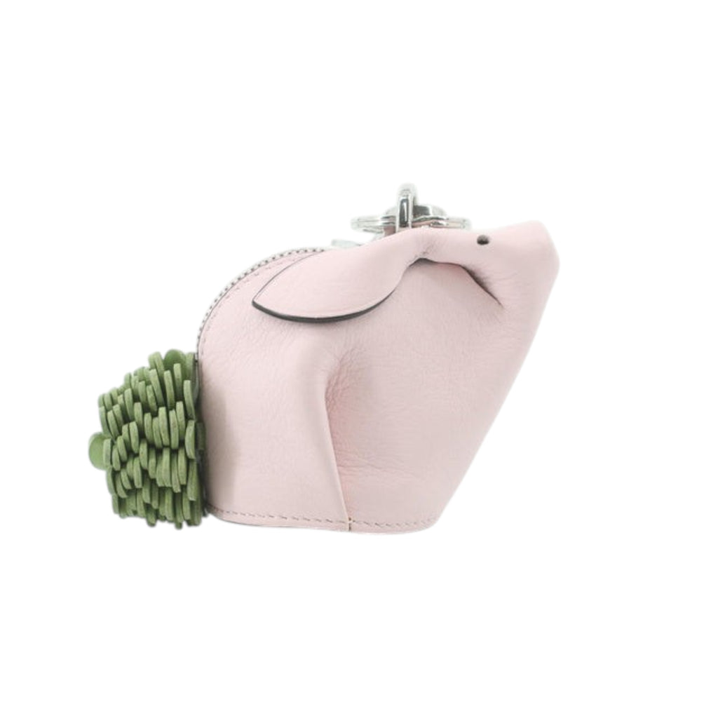 CURATED by Kira pink leather pig charm with green tassel tail and silver hardware.