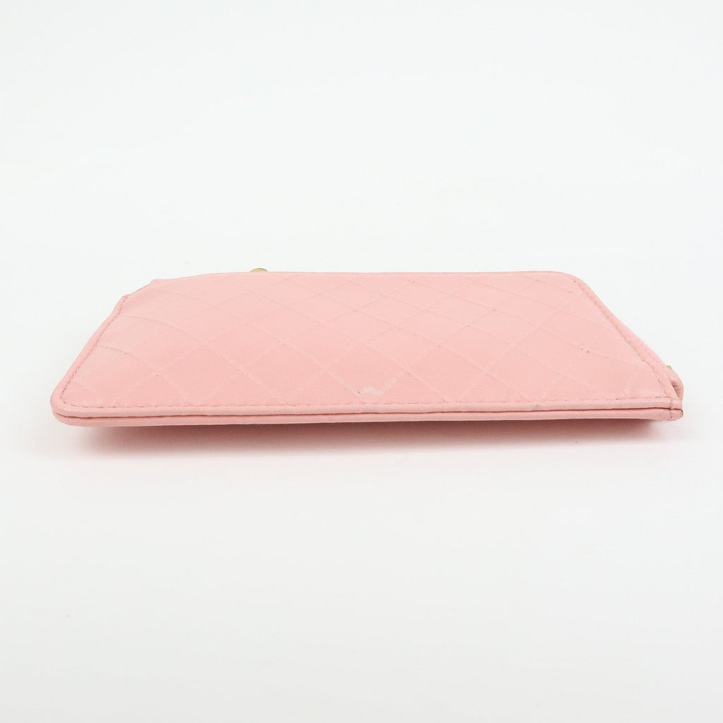 CURATED by Kira pink quilted leather zip-around card holder with floral charm. Compact and elegant.