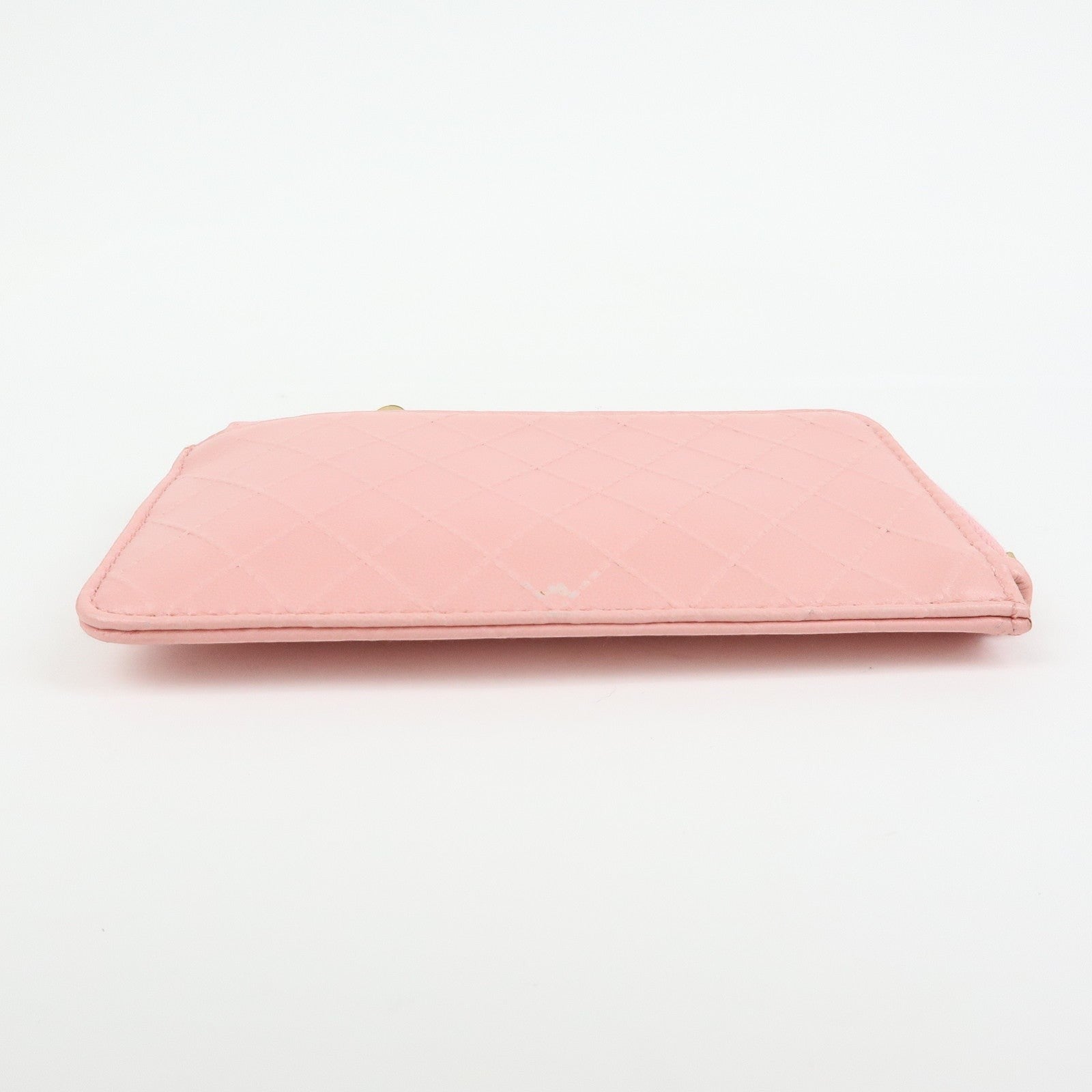 CURATED by Kira pink quilted leather zip-around card holder with floral charm. Compact and elegant.