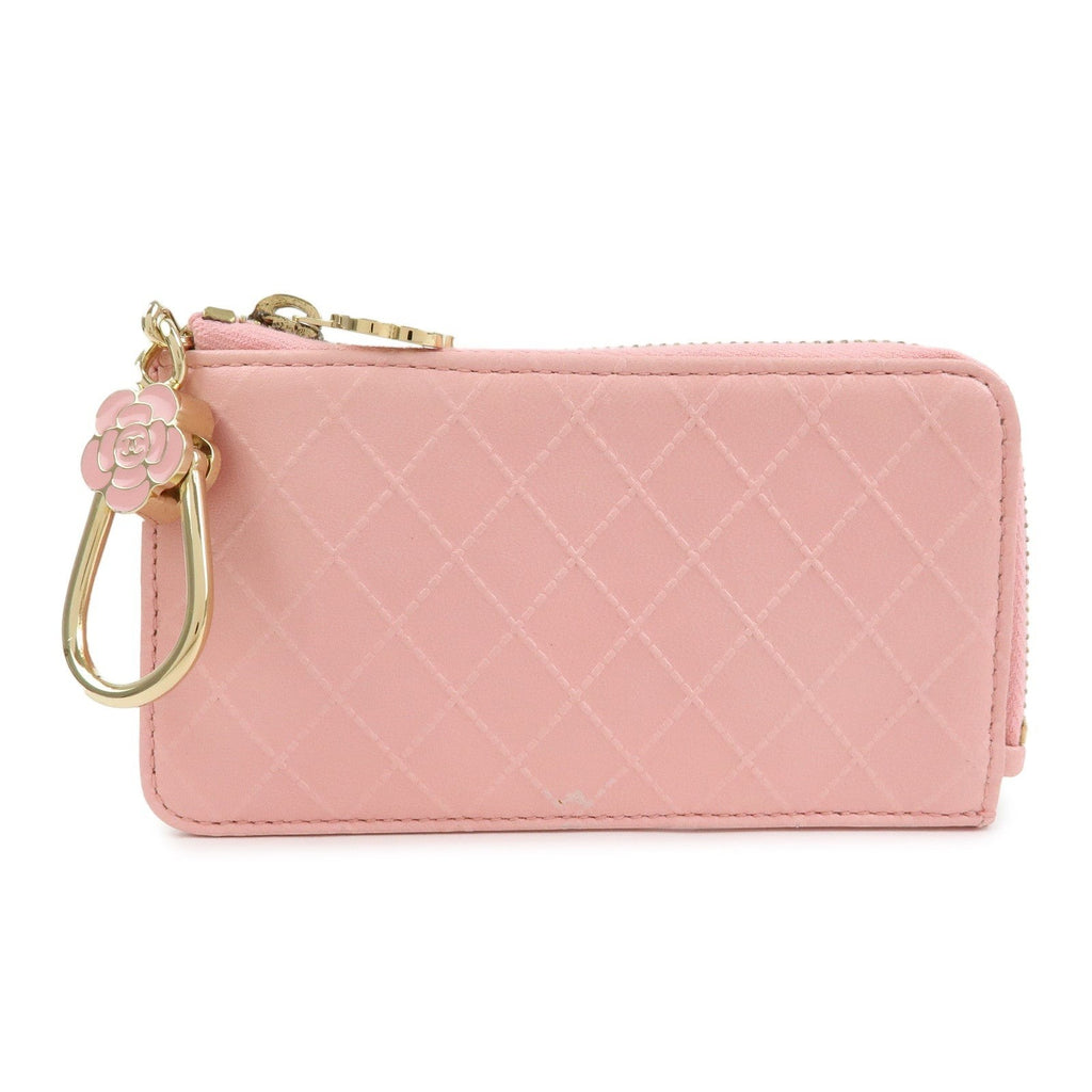 CURATED by Kira pink quilted leather zip-around card holder with floral charm and gold hardware.