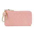 CURATED by Kira pink quilted leather zip-around card holder with floral charm and gold hardware.