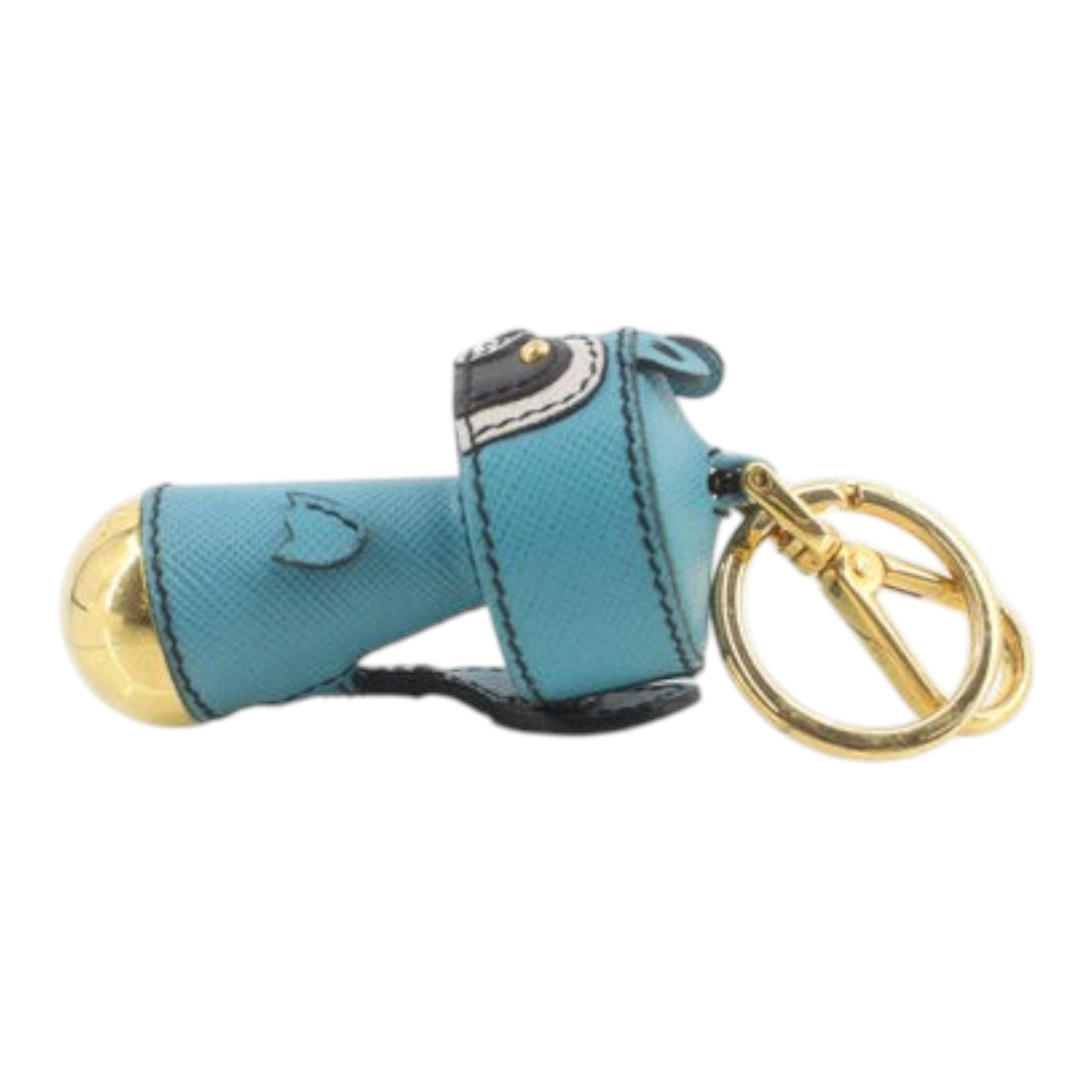 CURATED by Kira Prada raccoon key ring in teal Saffiano leather with gold-tone hardware and a circular key loop.