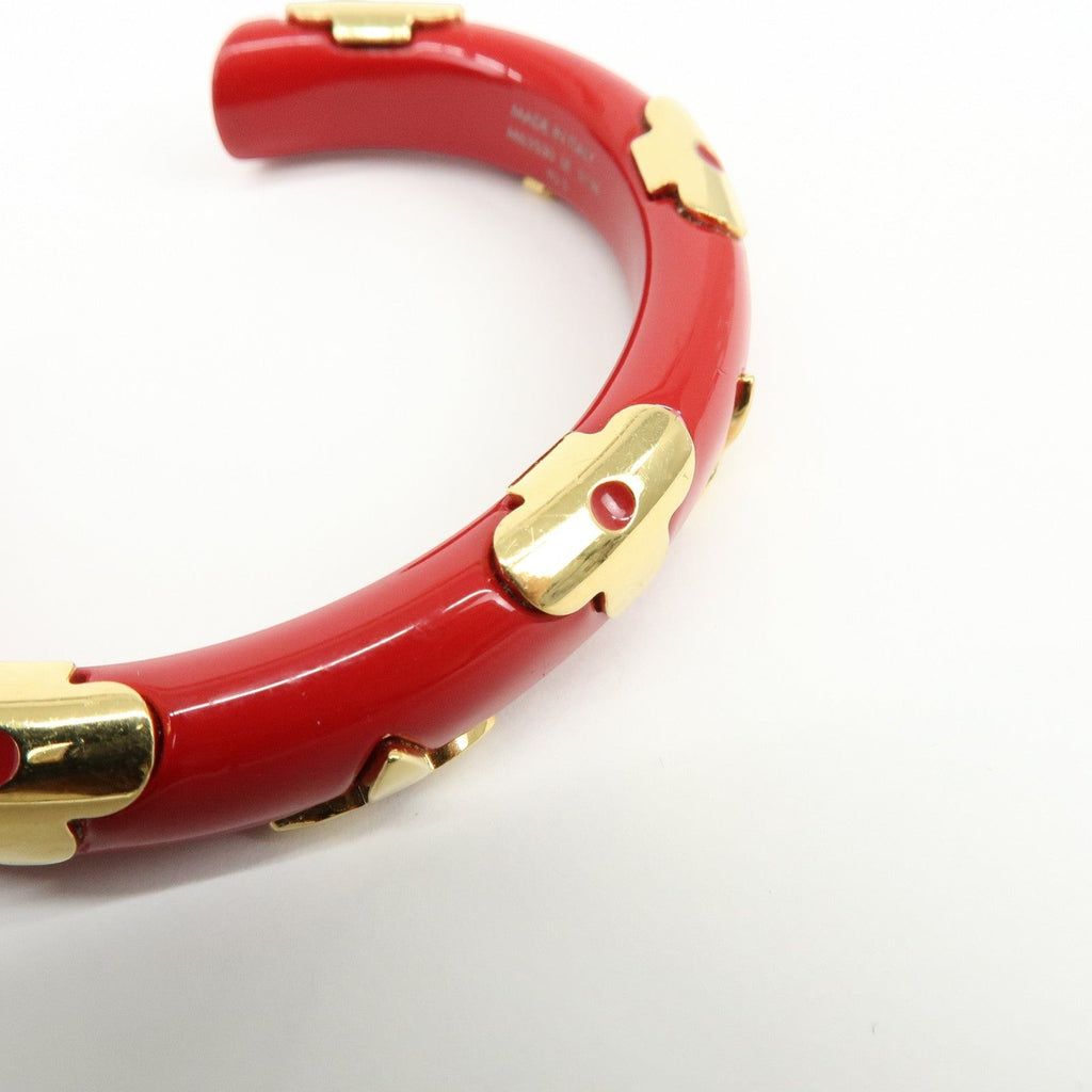 CURATED by Kira red ceramic and gold-tone metal Louis Vuitton Paris bangle bracelet with engraved interior.