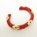 CURATED by Kira red ceramic and gold-tone metal Louis Vuitton Paris bangle bracelet with engraved interior.