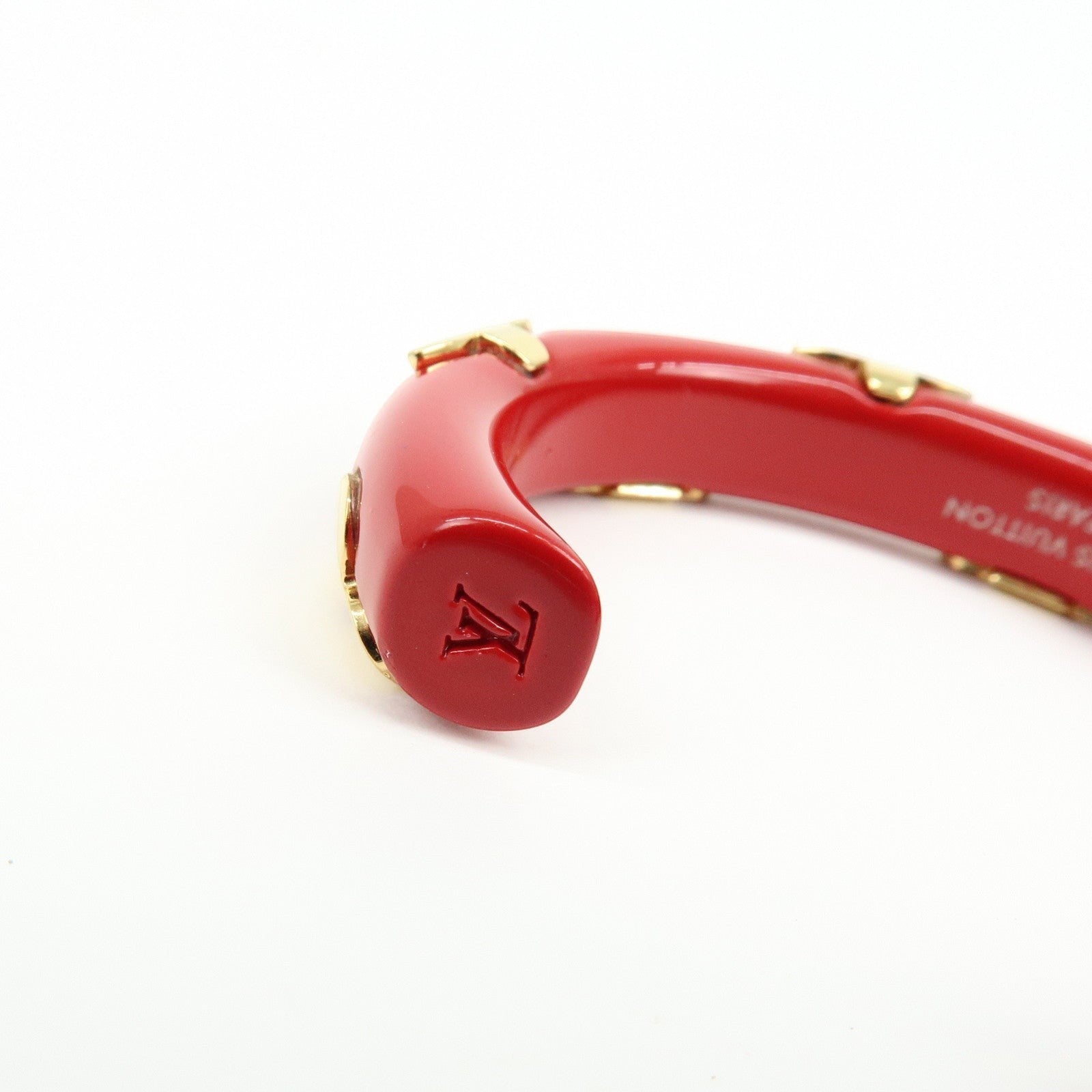 CURATED by Kira red resin and gold-tone metal Louis Vuitton Paris bangle bracelet with engraved LV logo