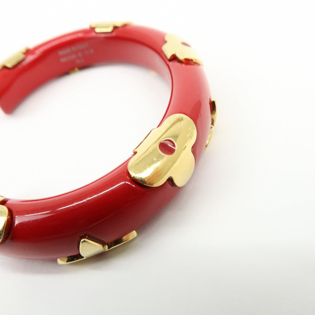 CURATED by Kira red ceramic and gold-tone metal Louis Vuitton Paris bangle bracelet with floral accents.