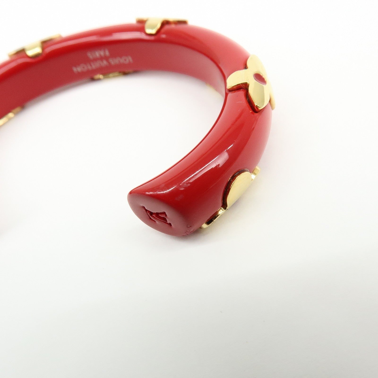 CURATED by Kira red ceramic and gold-tone Louis Vuitton Paris bangle bracelet with monogram flower details.