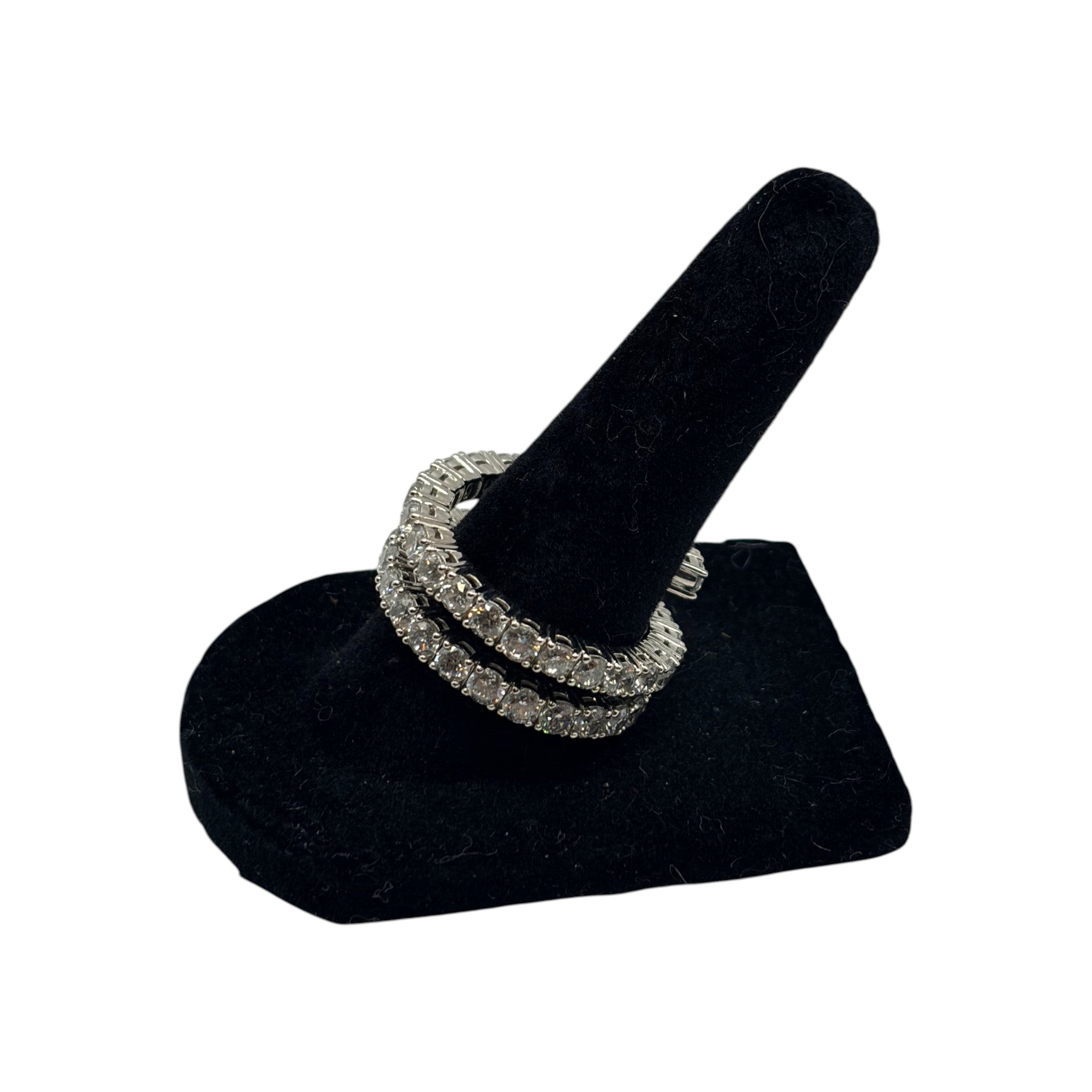 CURATED by Kira silver tone double row eternity band ring featuring sparkling cubic zirconia stones on black display
