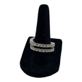 CURATED by Kira silver tone double row eternity band ring featuring sparkling cubic zirconia stones on a black stand