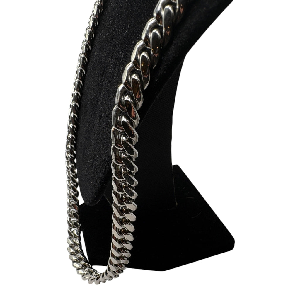 CURATED by Kira Steeltime silver-tone stainless steel curb link chain necklace on a black display stand