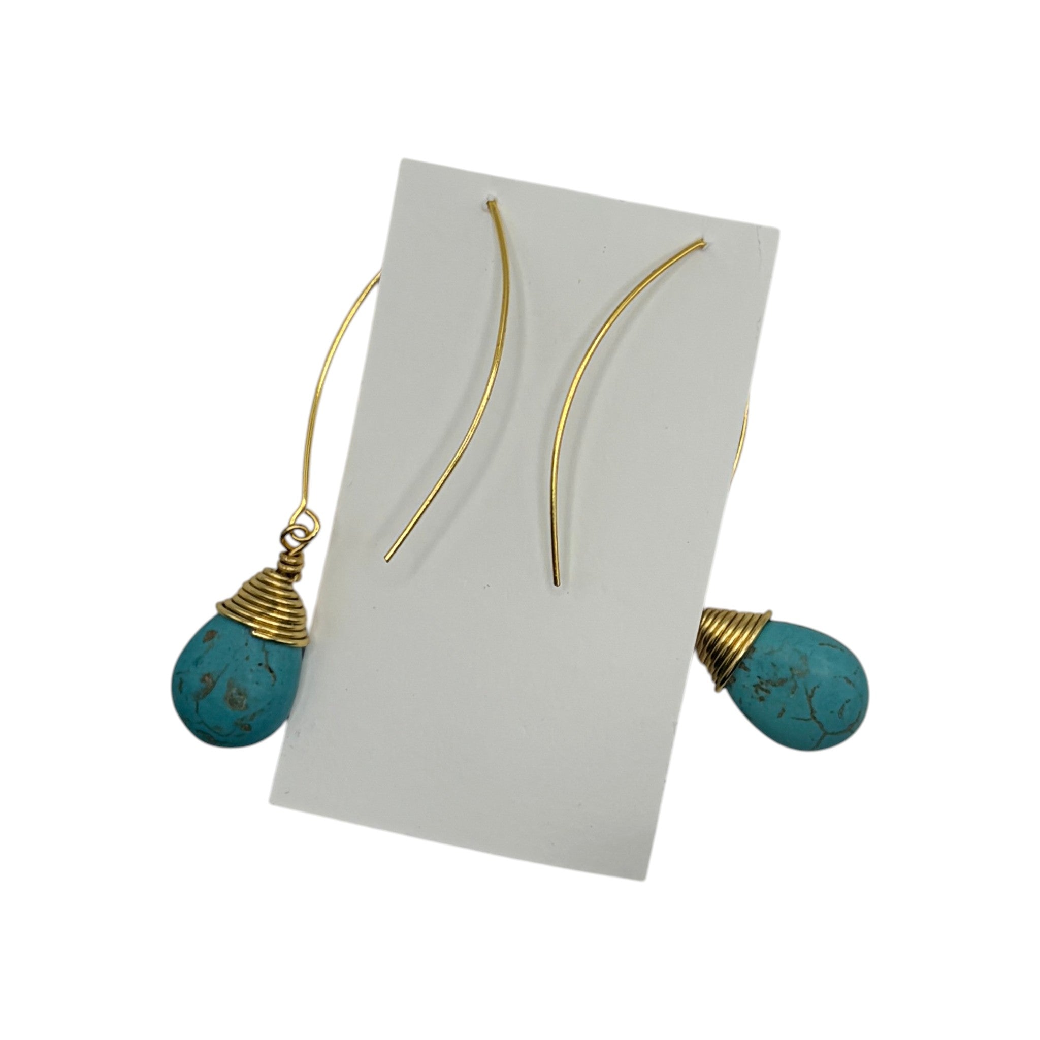 CURATED by Kira MINU Jewels turquoise teardrop dangle earrings with gold tone wire wrap detail on display card