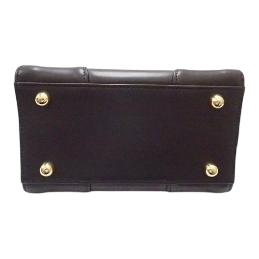 CURATED by Kira Vivienne Westwood black enamel handbag base with four gold protective feet